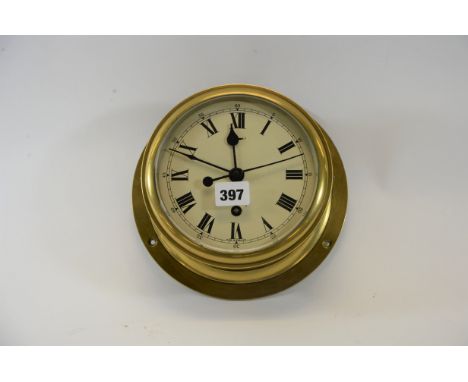 A GOOD QUALITY BRASS BULKHEAD SHIPS CLOCK, 6 ins cream enamel dial with sweep seconds hand and bayonet fitting bezel, stamped