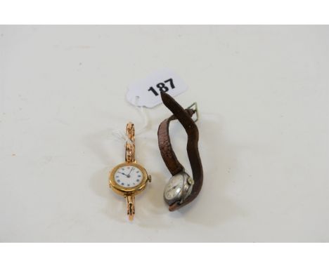 A LADY'S 9CT GOLD WRISTLET WATCH with white enamel dial on a gold strap (21 grams all in) and a lady's silver cased DITTO.  (