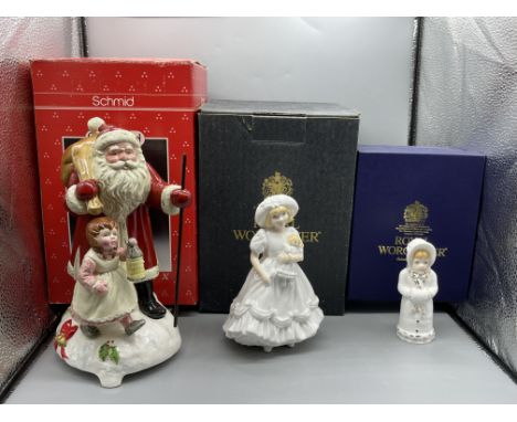 Boxed Schmid - Here Comes Santa Clause Music Box, Boxed Royal Worcester - Katie, and Boxed Royal Worcester - Girl With Muff. 
