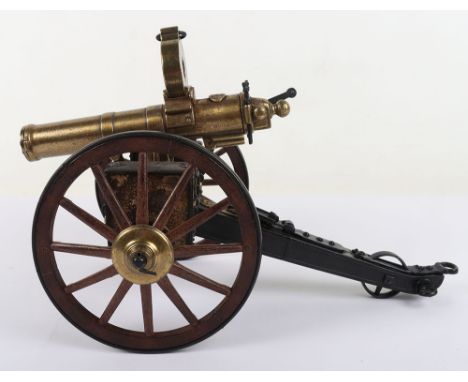 US Civil War Gatling Gun Model, A model of a gatling gun with operatable crank handle to rotate the barrels. Wooden wheels wi
