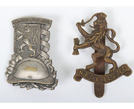WW2 Armies in Exile Badges, being a brass cap badge for the Free Dutch forces with slider fitting to the reverse and white me