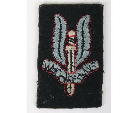 British Special Air Service (SAS) Cap / Beret Badge: Stitched felt SAS cap badge with backing cloth in good condition