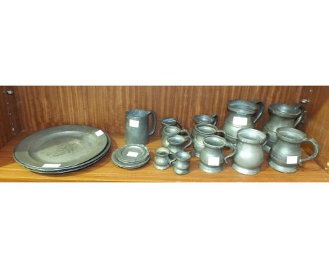 A collection of vintage pewter ware, including four plates, 23cm diameter, twelve tankards of various sizes, a mug and two pa