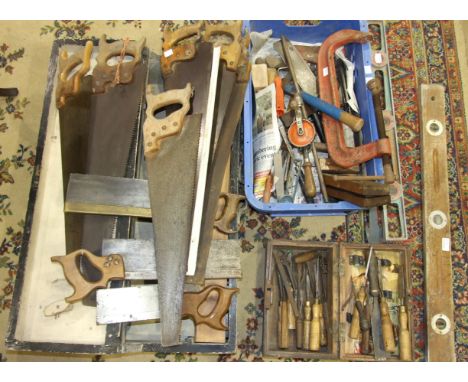 A collection of tools, including wooden planes, two braces, bits and other tools.