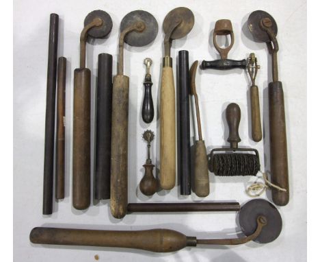 A collection of bookbinding and other tools and five lignum rulers.
