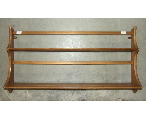 An Ercol two-shelf plate rack, 97cm wide, 50cm high.