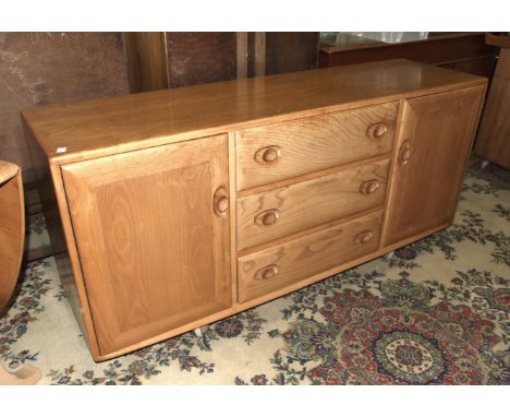 An Ercol light oak sideboard, 153cm wide, 69cm high.