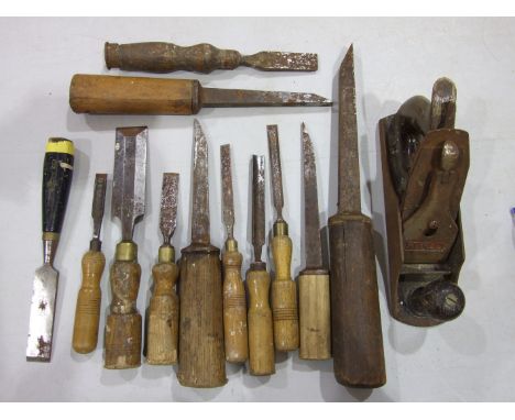 A collection of chisels, a Stanley plane and other tools, in two boxes.