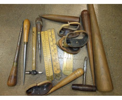 A collection of sail makers, wood fids, palms and other tools, in two tool boxes.
