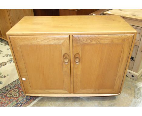 A small Ercol two-door sideboard, 91cm wide, 70cm high.