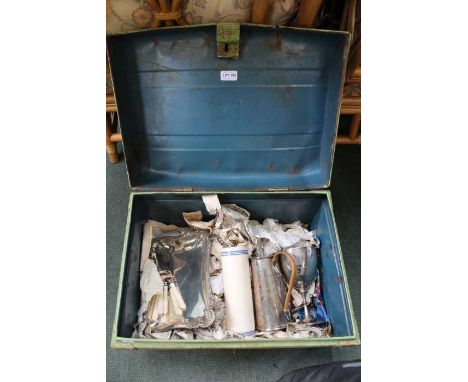 A green tin trunk containing a selection of domestic items, to include coffee pot, trophy, etc.