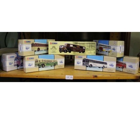 A shelf of boxed model transport vehicles.