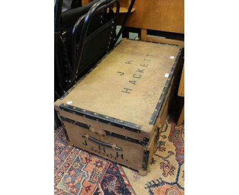 A large tin trunk - J H Hacket inscribed to the lid and the sides.