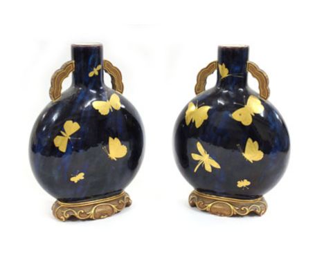A pair of Royal Worcester flasks gilt decorated in the chinoiserie manner with insects on a mottle blue ground, h. 21.5 cm   