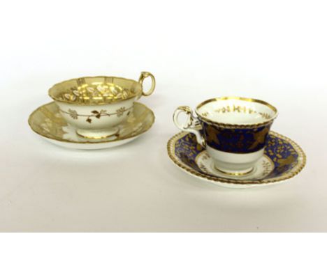 A 19th century Rockingham-style trio and a Spode tea cup and saucer (5)   CONDITION REPORT:  Hairline cracks and chips