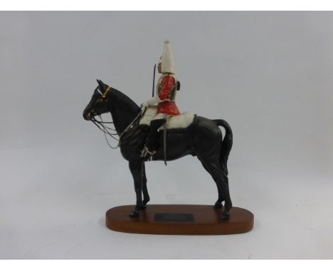 A Beswick figure modelled as a lifeguard on horseback, Model No. 2562   CONDITION REPORT:  Signs of glue to underside of scab