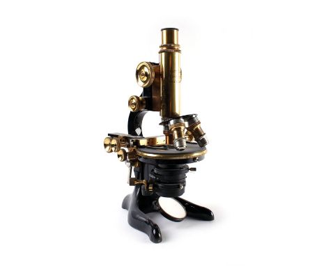 A monocular microscope by Ernst Leitz Wetzlar with a fitted case and five spare lenses, No. 212291