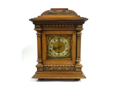 An early 20th century mantle clock, the Schlenker & Kienzle movement with five chimes, the brass and silvered dial with Arabi