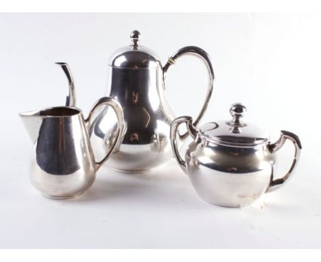 A German metalware three piece tea service of plain bulbous form, 15 ozs   CONDITION REPORT:  Sugar bowl cover damaged.