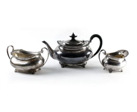 A silver three piece tea service of boat shaped form, maker HA, Sheffield 1910, 35 ozs   CONDITION REPORT:  Would benefit fro