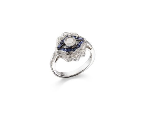 A SAPPHIRE AND DIAMOND DRESS RING The central brilliant-cut diamond within a scalloped openwork surround, set with calibré-cu