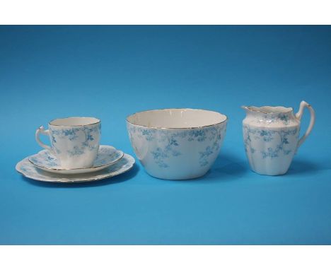 A Charles Wileman Foley china tea service, decorated with blue roses. Comprising of; two cake plates, a sugar bowl, a cream j