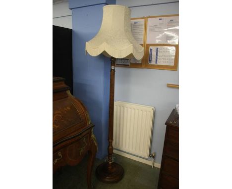 A walnut standard lamp and shade