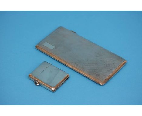 A silver vesta case and a rectangular silver engine turned cigarette case. Weight 10.2 oz/319 grams