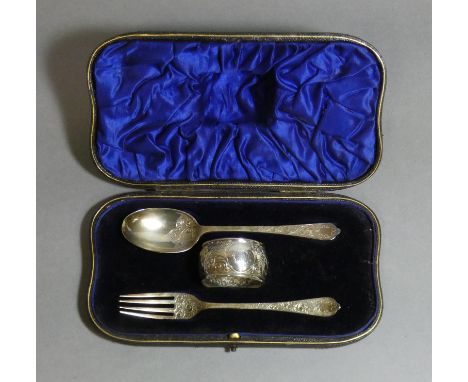 An Edwardian silver christening set of dog-nosed spoon &amp; fork with engraved scroll decoration, &amp; matching napkin ring