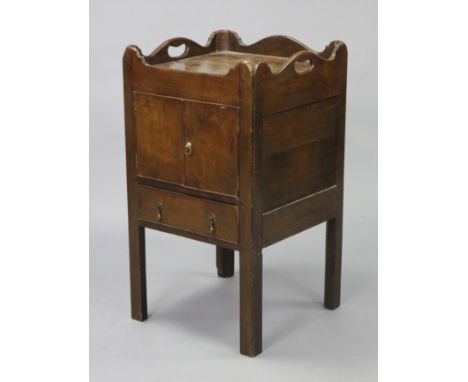 A late 18th century oak small tray-top bedside commode enclosed by a pair of panel doors, on square chamfered legs, 17” wide 