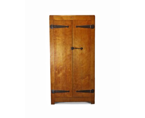 A ROBERT “MOUSEMAN” THOMPSON OAK WARDROBE, circa 1930, with adzed surfaces, enclosed by pair of panel doors with iron hinges 