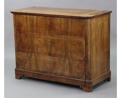 A 19th century French walnut commode with rectangular top &amp; canted corners, fitted three long graduated drawers, on short