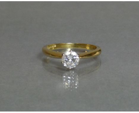 A diamond solitaire, the round-cut stone weighing approx. 0.5 carat, set to an 18ct yellow gold shank; size K/L, weight 3.3g.