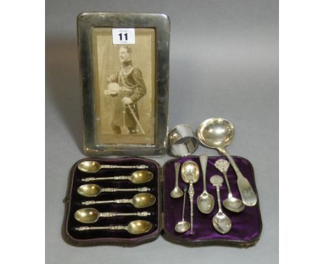 A set of six late Victorian silver apostle coffee spoons, London 1878 by Lias &amp; Wakely, in fitted case; a Fiddle pattern 