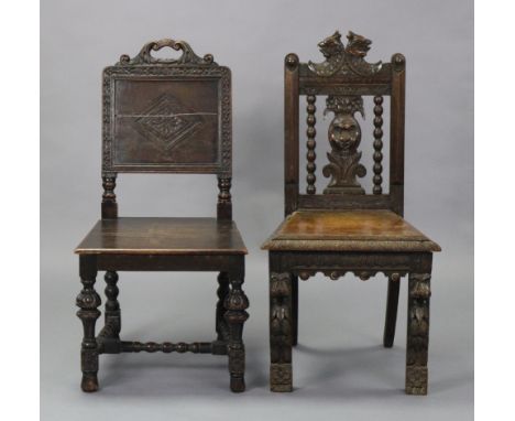 Two Victorian carved oak Gothic-style hall chairs, each with hard seat, one with panel-back, one with relief-carved mask &amp