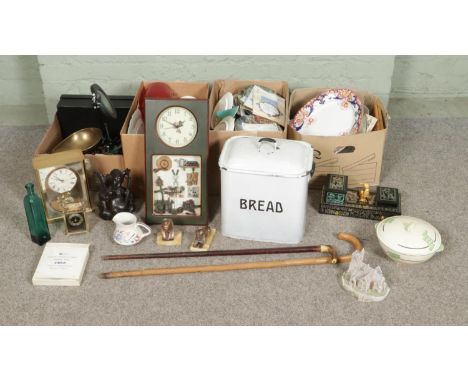 Four boxes of miscellaneous to include enamel bread bin, two walking sticks, Egyptian sphinx figures, assorted cabinet plates