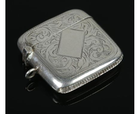 A George V silver vesta, with scrolled engraving and blank cartouche. Assayed for Birmingham, 1915 by William Hair Haseler. T
