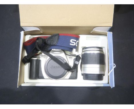 Canon EOS 300 kit complete, includes film camera, 28 to 90mm zoom lens. UK P&amp;P Group 2 (£20+VAT for the first lot and £4+