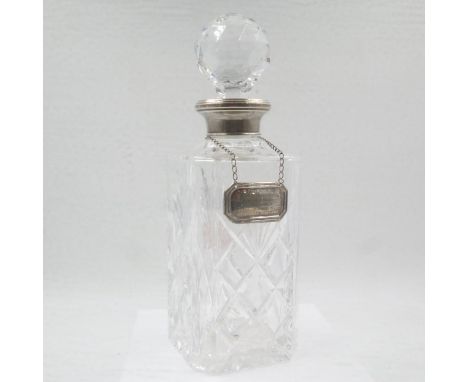 Crystal decanter with hallmarked silver top and a silver wine label. UK P&amp;P Group 3 (£30+VAT for the first lot and £8+VAT