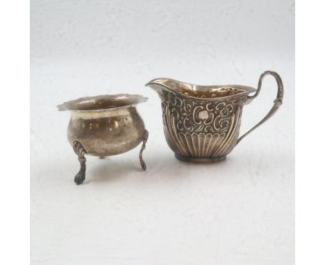 Hallmarked silver repousse decorated cream jug with gilt washed interior, with a hallmarked silver open salt, combined 81g. U