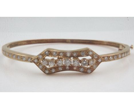 18ct rose gold bangle set with forty small and seven large diamonds, 15.3g. UK P&amp;P Group 0 (£6+VAT for the first lot and 