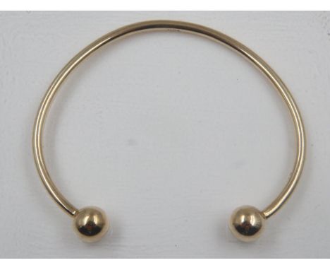 9ct gold torq bangle, 8.9g. UK P&amp;P Group 0 (£6+VAT for the first lot and £1+VAT for subsequent lots)
