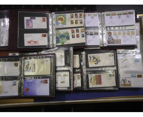 Six albums of first day covers and an empty album. UK P&amp;P Group 2 (£20+VAT for the first lot and £4+VAT for subsequent lo