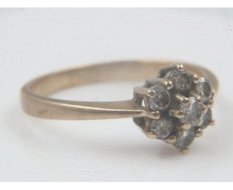 9ct gold flower head diamond ring set with seven diamonds totalling 0.5cts, size T, 2.9g. UK P&amp;P Group 0 (£6+VAT for the 