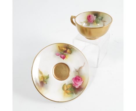 A Royal Worcester miniature tea cup and saucer, decorated with roses by Millie Hunt, 1925 Condition report: Condition commens