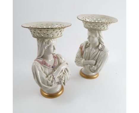 A pair of 19th century Royal Worcester pedestal dishes, the pierced circular basket tops raised on busts of a male and female