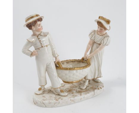 A Royal Worcester Hadleys Kate Greenaway figure, modelled as two children carrying a basket, on an oval base, dated 1883, hei