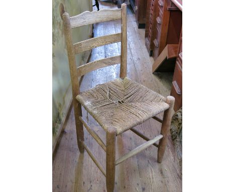 A set of eleven ladder back chairs, by Gordon Russell, circa 1930s, with rush seats