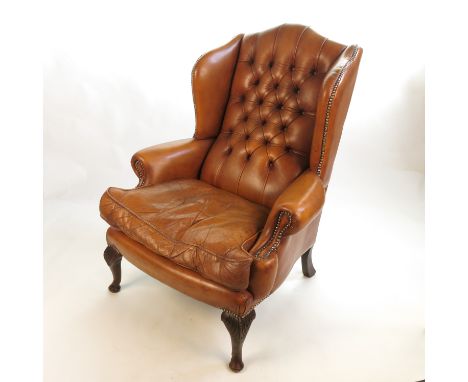 A leather Georgian style button back armchair Condition report: No obvious tears or splits to leather.  Slight scuffing to le