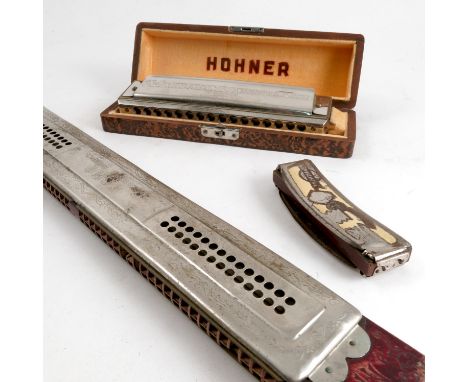 A cased Hohner 64 chronomonica, together with M Hohner Echo harmonica and another smaller harmonica